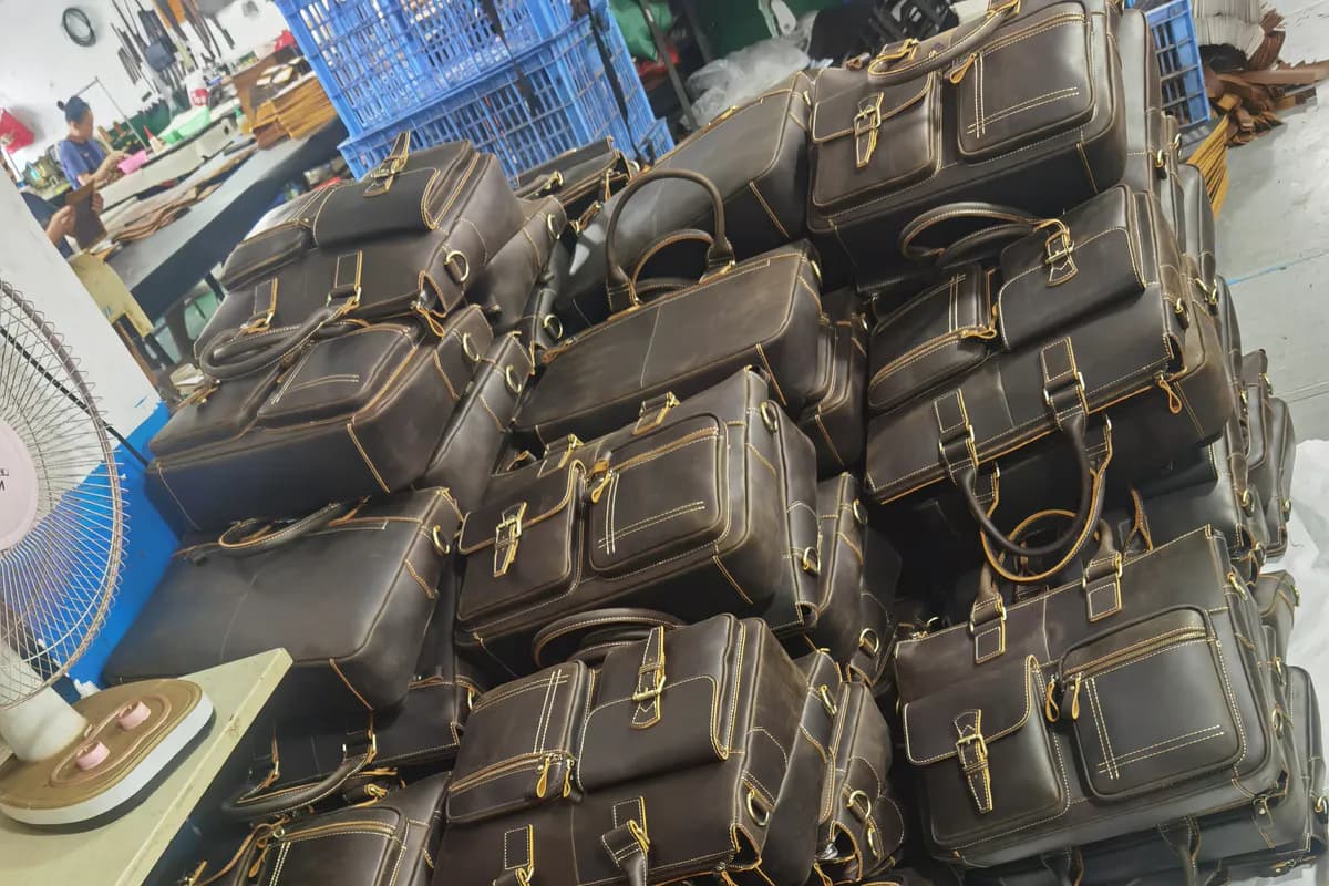 Custom leather bags progressing through bulk production