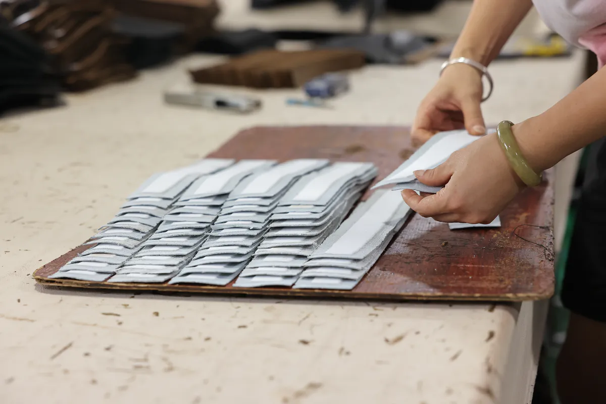 Cut leather components prepared for custom product assembly