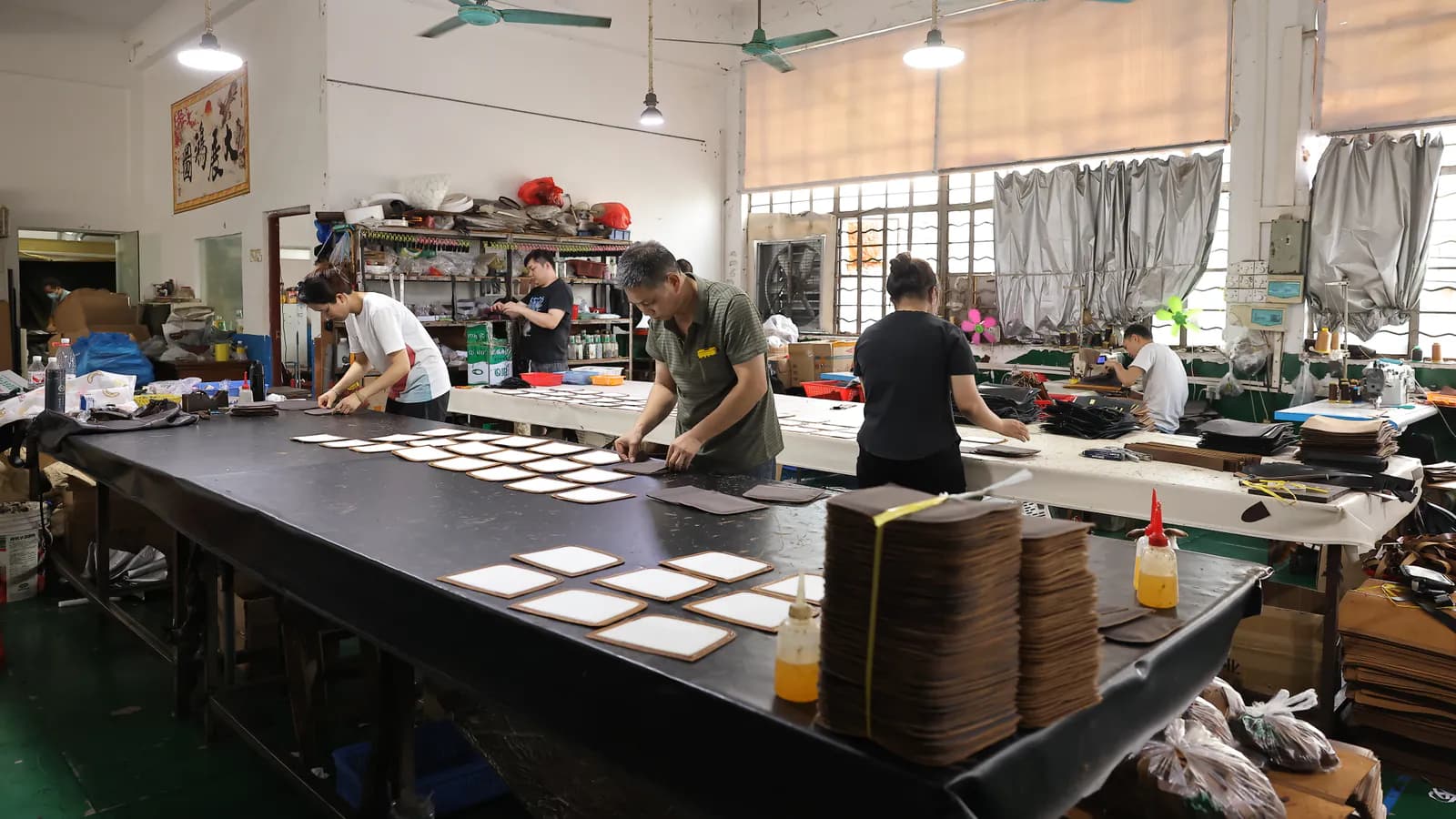 Marrant leather goods production team working on custom orders