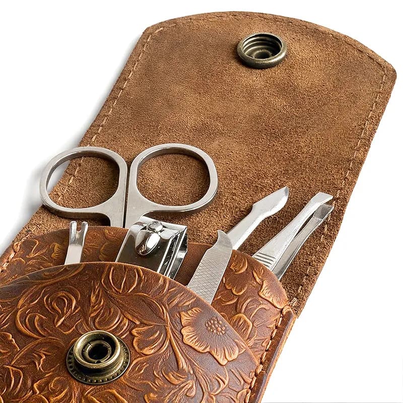 Style Q1002 embossed top-grain leather manicure scissors pouch shown open and closed