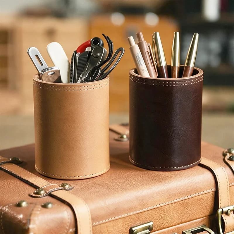 Brown leather pen holder product views showing the cylindrical stitched construction